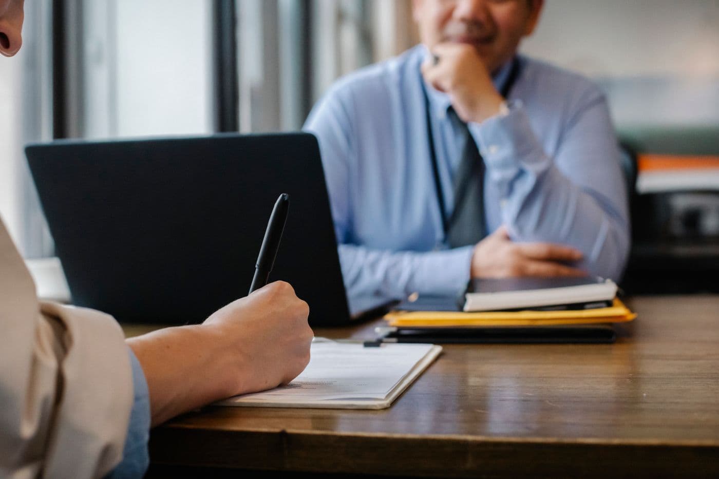 A solicitor advising a client during a consultation